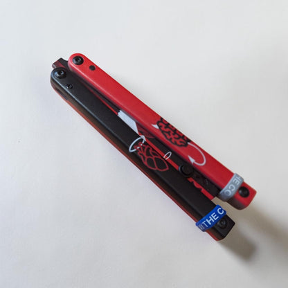 JKR 0849 drugelio tipo (Balisong) treniruočių peilis, 11 cm, plastikinis, lengvas